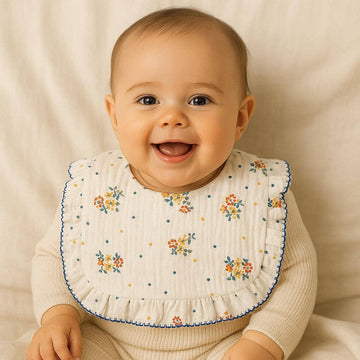 26001 ORGANIC COTTON BIB 30CM X 26CM: FLOWERS AND BLUE SPOTS